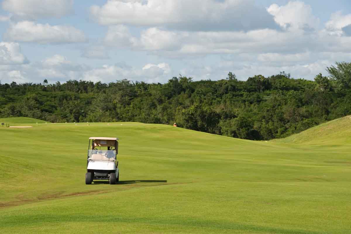 Golf cart on a hilly golf course