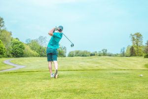 Man swinging a golf club